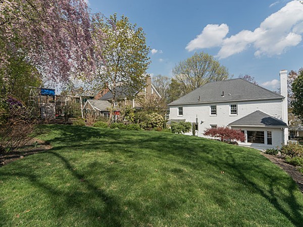 50 Blake Road Brookline, MA 02445 - Photo 16 of 18 a front view of house with yard and green space