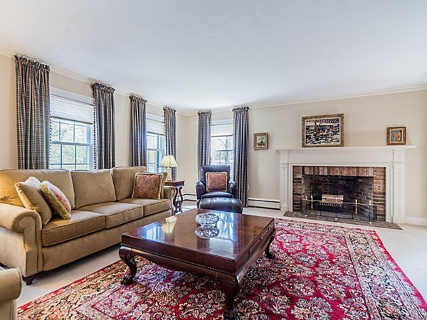 50 Blake Road Brookline, MA 02445 - Photo 3 of 18 a living room with furniture and a fireplace