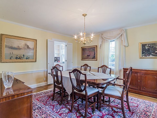 50 Blake Road Brookline, MA 02445 - Photo 4 of 18 a view of a dining room with furniture a chandelier and wooden floor