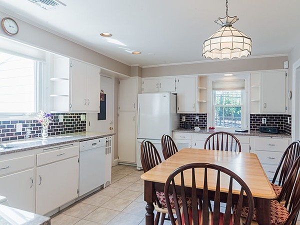 50 Blake Road Brookline, MA 02445 - Photo 8 of 18 a view of a dining room with furniture and chandelier