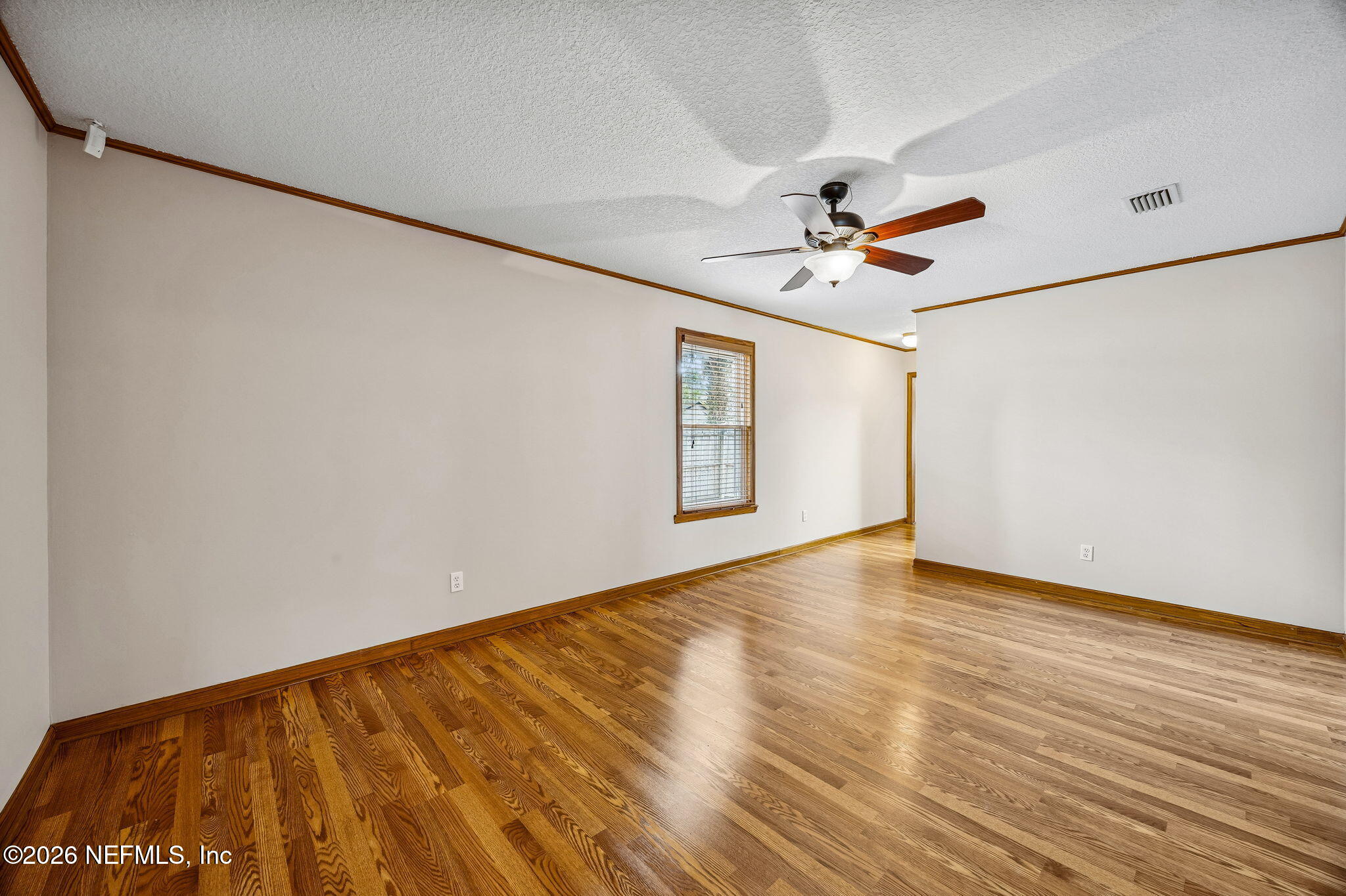 1888 Clemson Road Jacksonville, FL 32217 - Photo 34 of 41 wooden floor in an empty room with a window