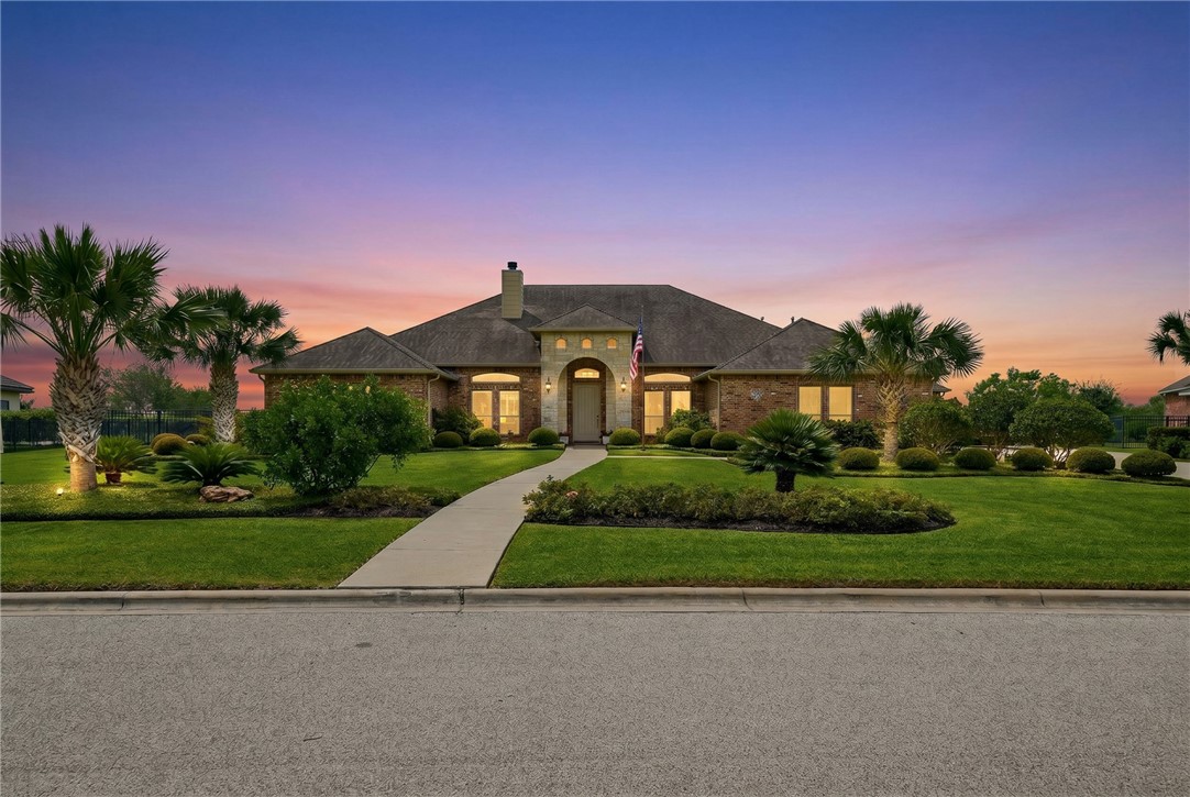 8710 KIng Ranch Drive Corpus Christi, TX 78414 - Photo 2 of 38 a front view of a house with a yard