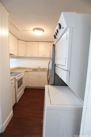 a view of washer and dryer with wooden floor