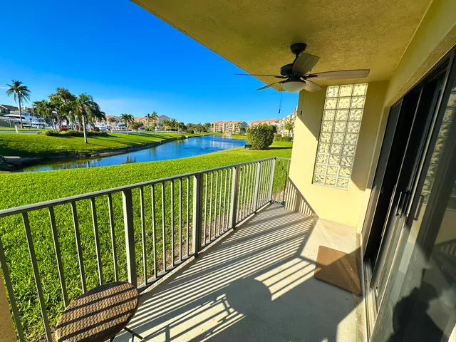 a view of a balcony with wooden floor