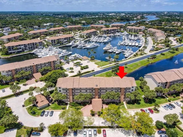 an aerial view of residential building and lake