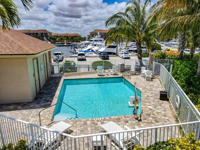 a view of a backyard with sitting area