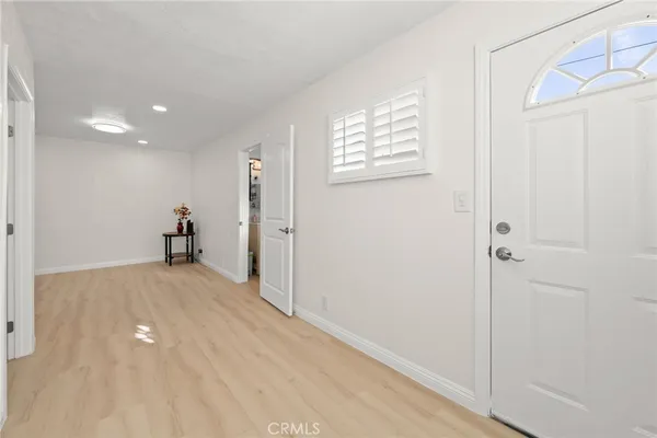 a bathroom with a sink vanity mirror and toilet