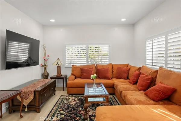 a view of a brick house next to a road