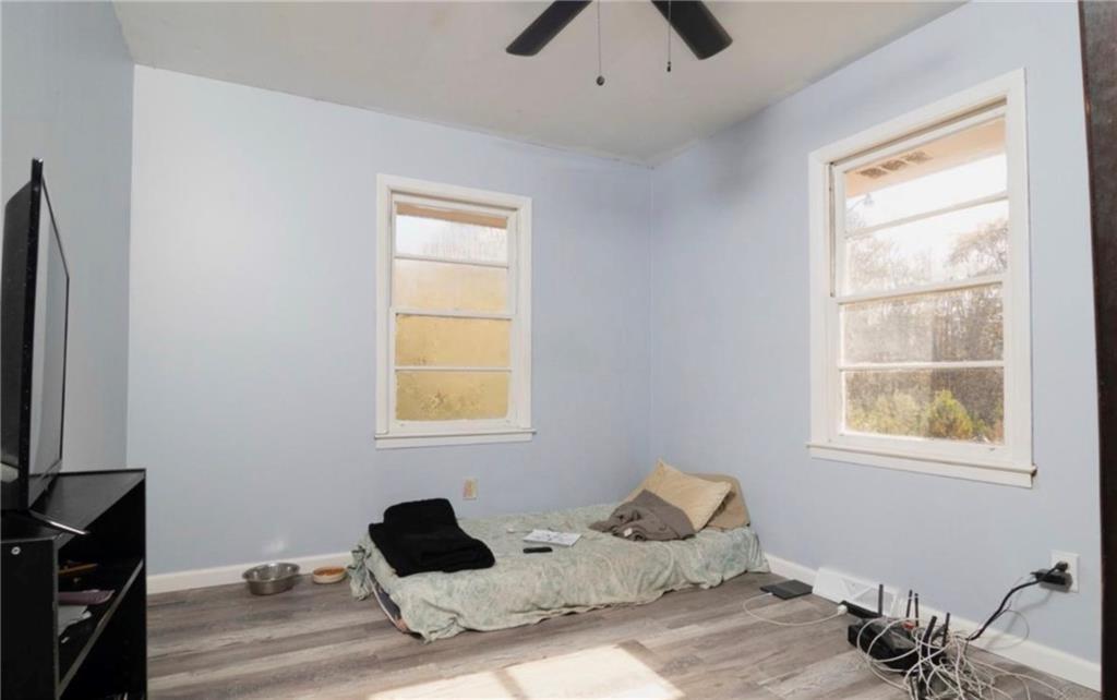 98 Almon Church Road Covington, GA 30014 - Photo 17 of 22 a bedroom with a bed and a window