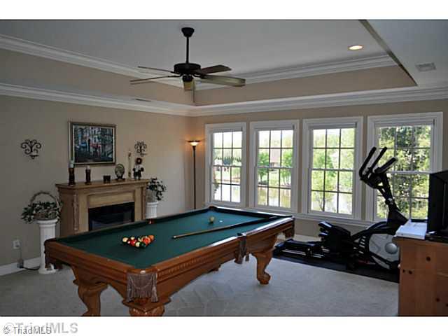 8401 Parkchester Place Oak Ridge, NC 27310 - Photo 12 of 16 Bonus. This handsomely big bonus room with its tray ceiling looks out to the pond on onside and into the foyer on the other.