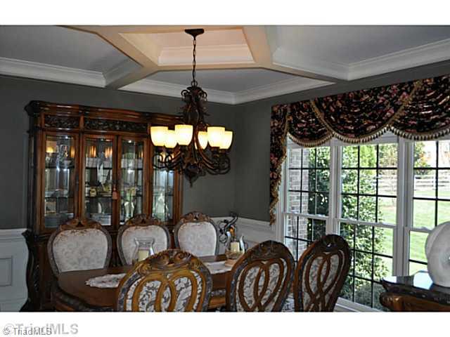 8401 Parkchester Place Oak Ridge, NC 27310 - Photo 3 of 16 Dining Room. This lovely formal dining room enjoys a stunning coffered ceiling.
