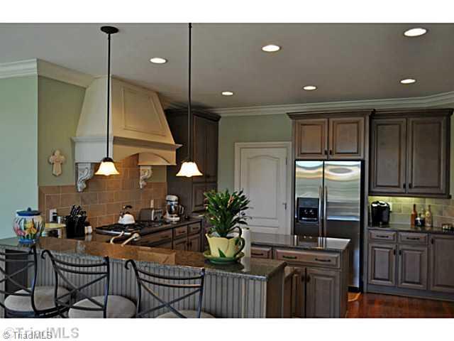 8401 Parkchester Place Oak Ridge, NC 27310 - Photo 6 of 16 Kitchen. You will love preparing your favorite dishes in this big Chef s kitchen with all Kitchen-Aid stainless steel appliances.