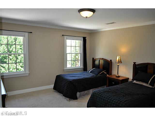 8401 Parkchester Place Oak Ridge, NC 27310 - Photo 10 of 16 3rd Bedroom. The largest of the second floor bedrooms also offers a cavernous walk-in closet and a full en suite bath.
