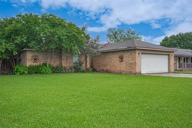 a backyard of a house with lots of green space