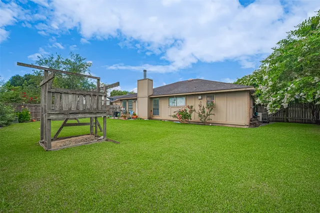 a view of a backyard with a garden