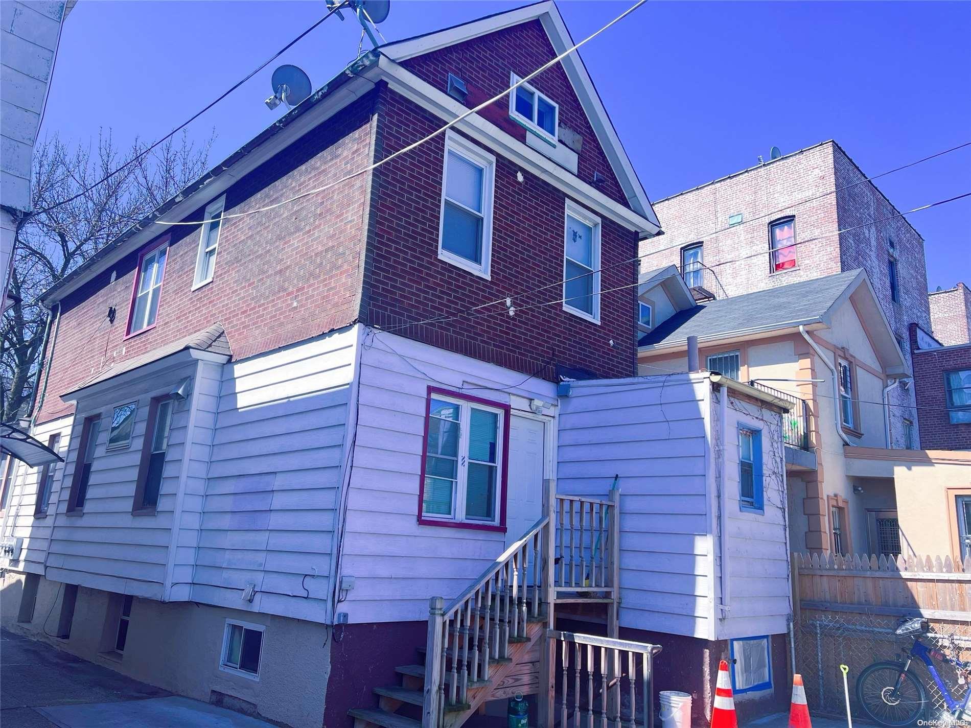 43-13 Forley Street Queens, NY 11373 - Photo 1 of 1 a red brick building with glass windows
