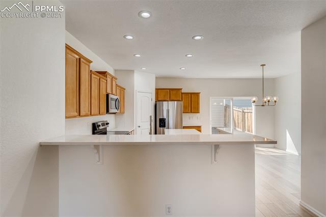 6338 Pilgrimage Road Colorado Springs, CO 80925 - Photo 8 of 28 Newly Upgraded Kitchen with Pantry