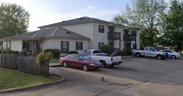 a view of a car parked in front of a house