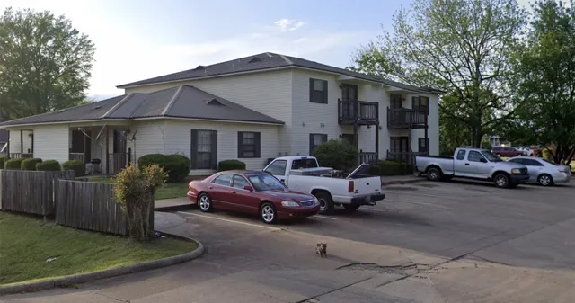 a view of a car parked in front of a house