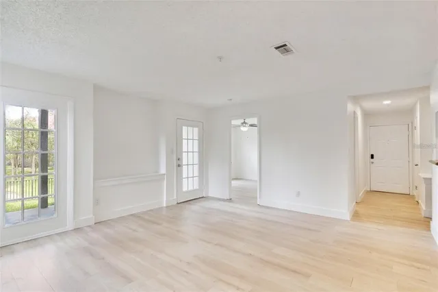 a view of an empty room with a window