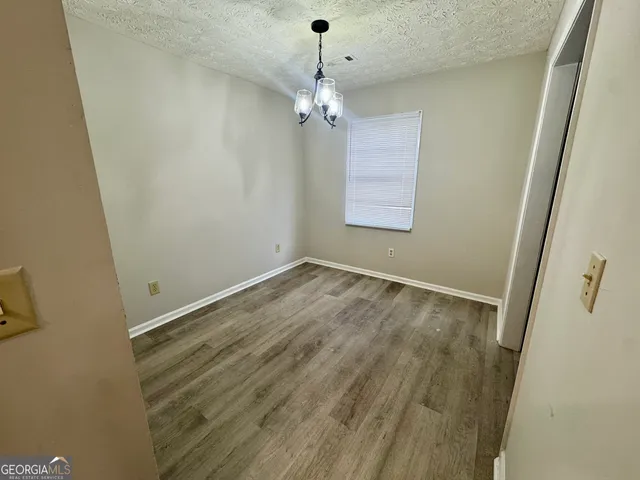 a view of a hallway with a window