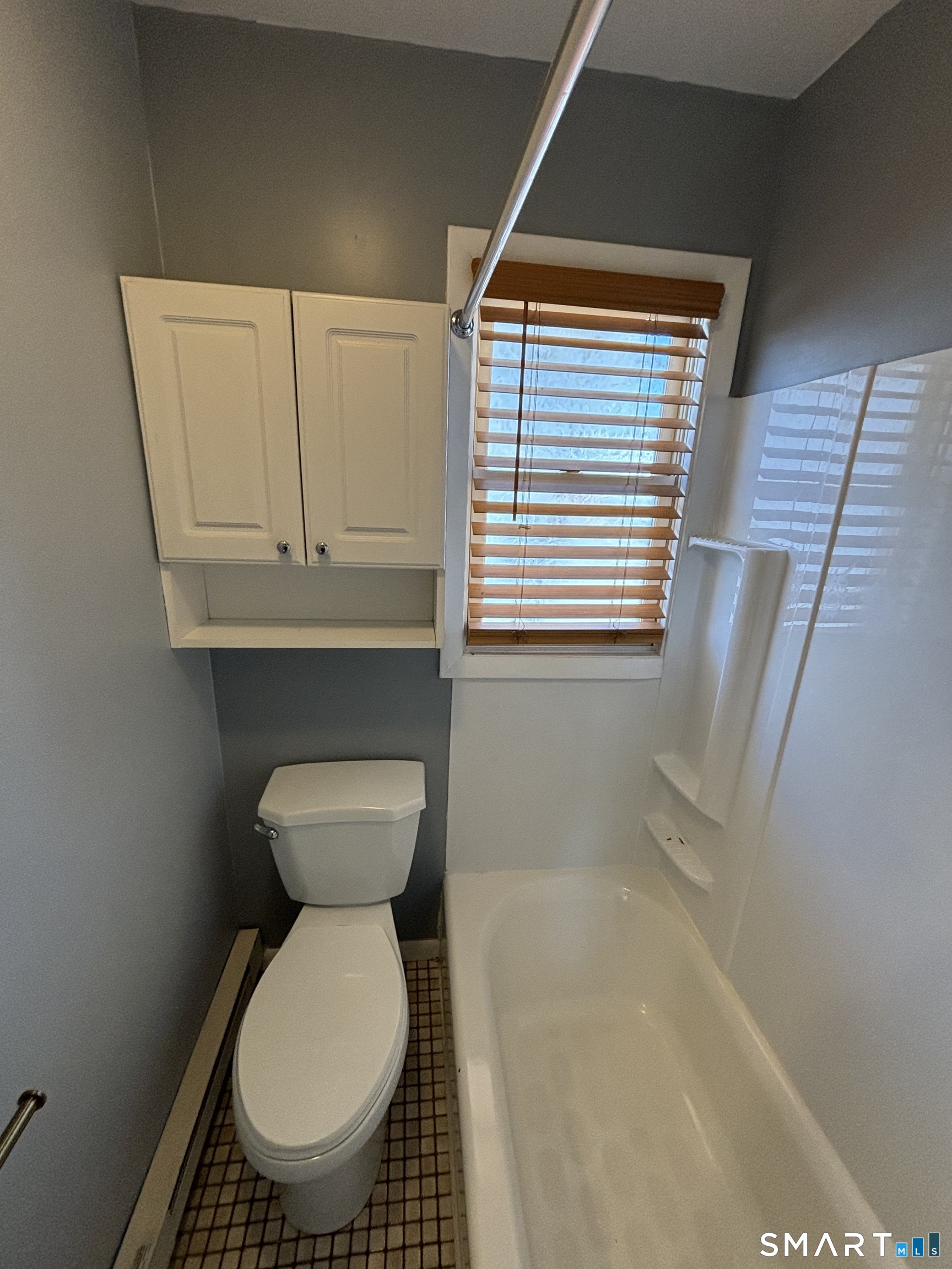 11 Roberts Street, Unit 2 Bristol, CT 06010 - Photo 10 of 11 a bathroom with a toilet a sink and a window