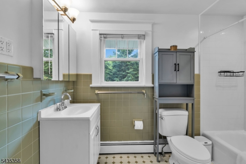 105 Somerville Road Bedminster, NJ 07921 - Photo 22 of 36 a bathroom with a sink a toilet and a mirror