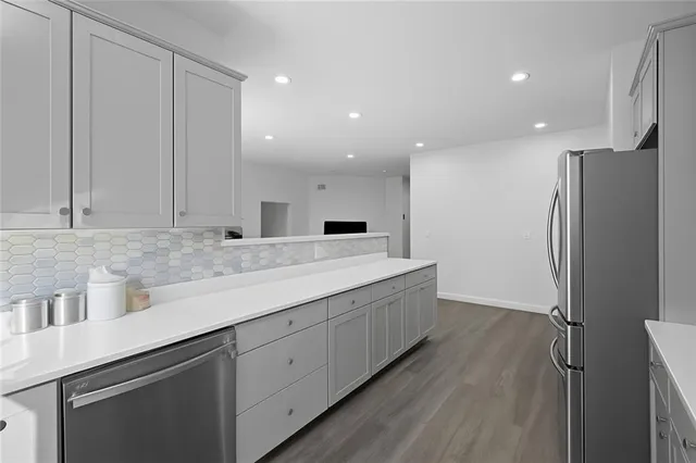 a bathroom with a double vanity sink and mirror