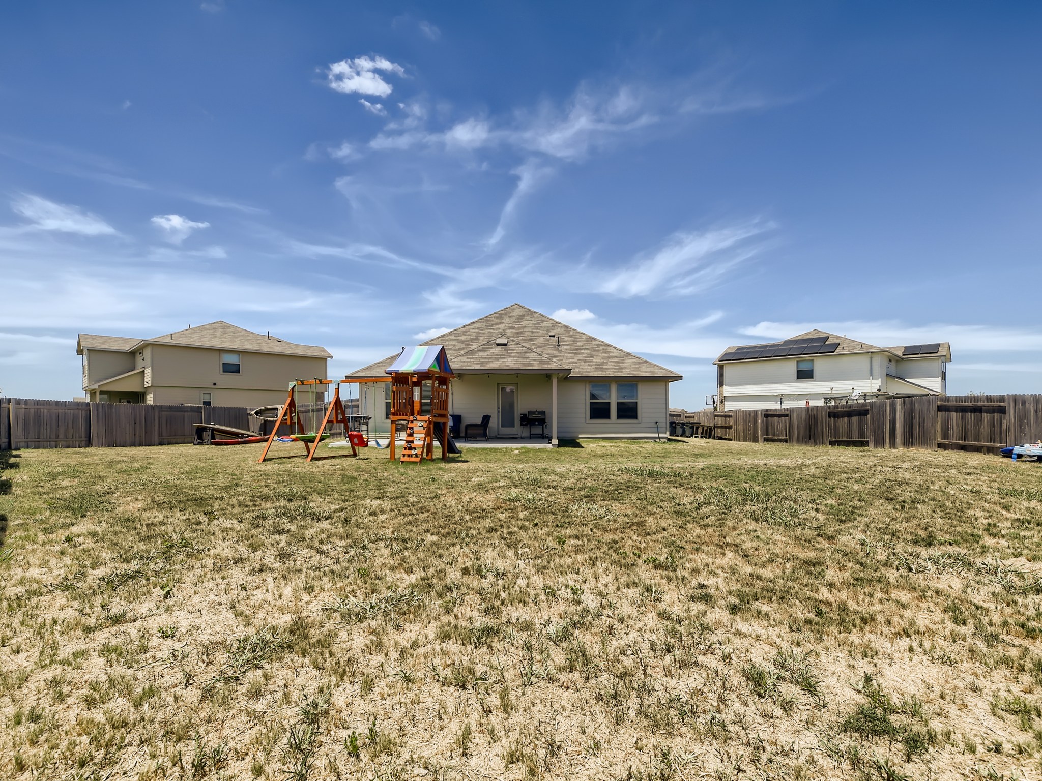 195 Star Light Way Kyle, TX 78640 - Photo 27 of 29 a big house with a big yard and large trees