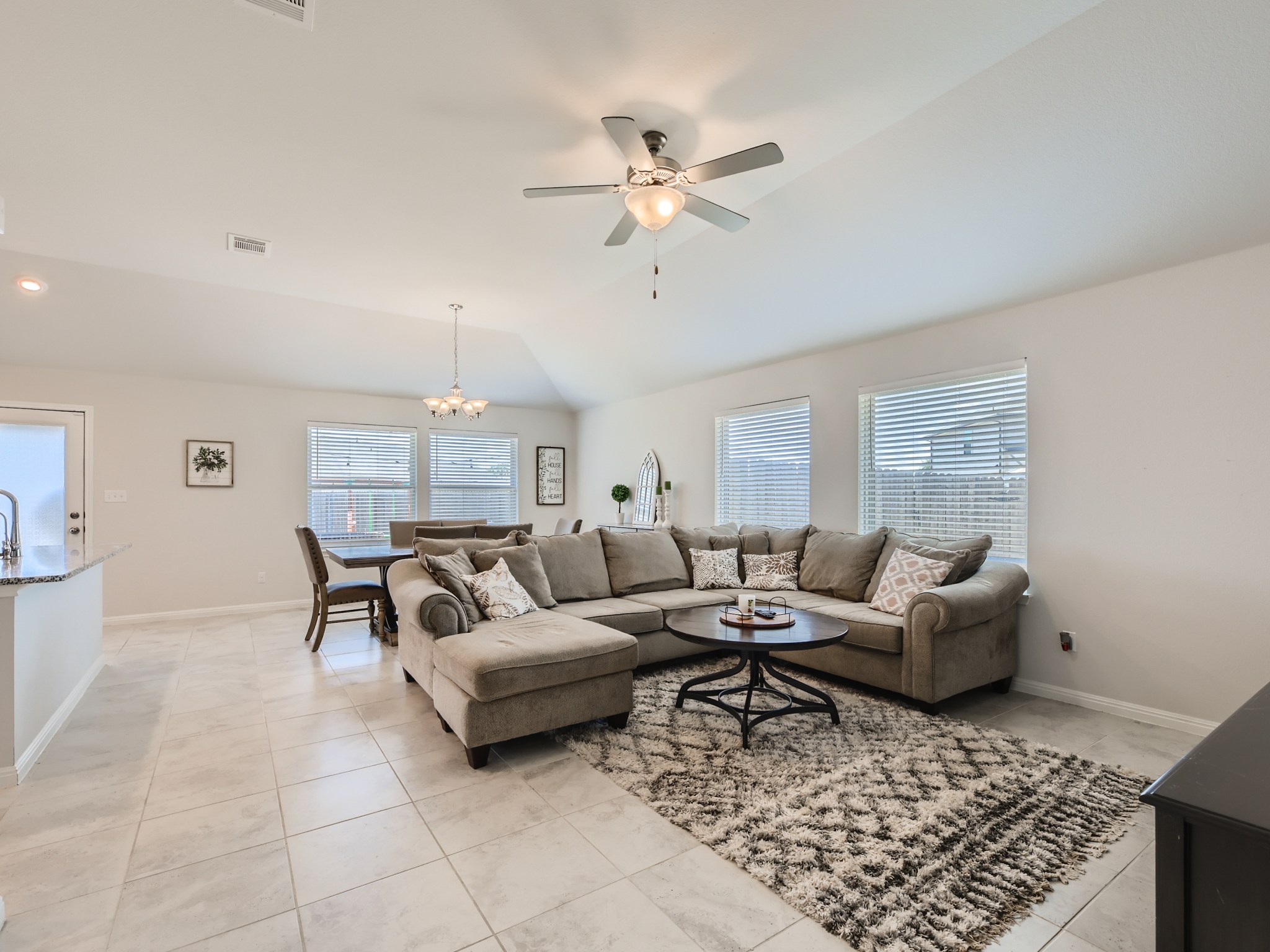 195 Star Light Way Kyle, TX 78640 - Photo 5 of 29 a living room with furniture and a rug