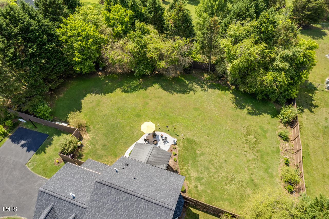 135 Deep Creek Rougemont, NC 27572 - Photo 68 of 72 an aerial view of a house with a yard and lake view