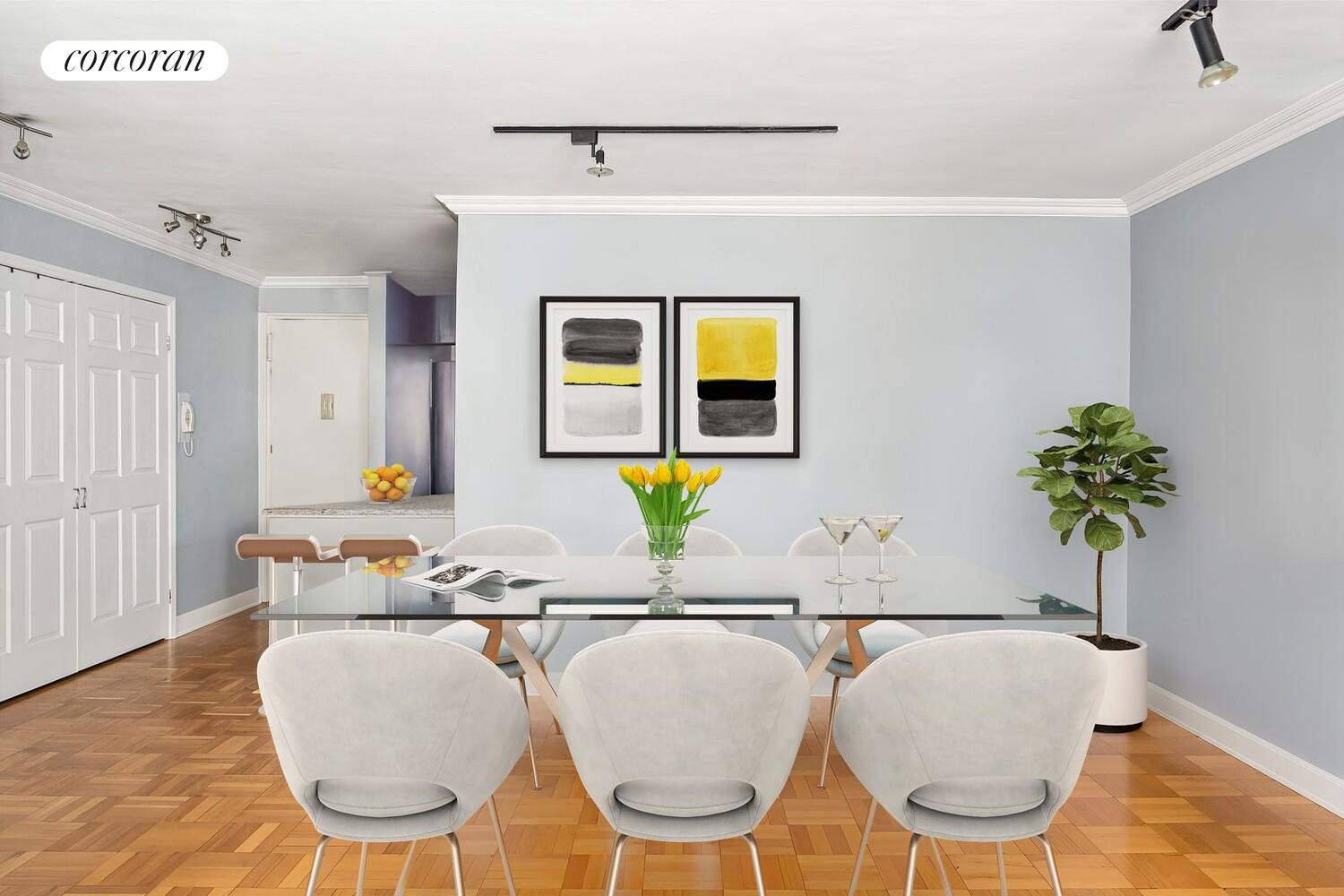 139 East 33rd Street, Unit 7L Manhattan, NY 10016 - Photo 4 of 11 a living room with a couch and paintings on the wall