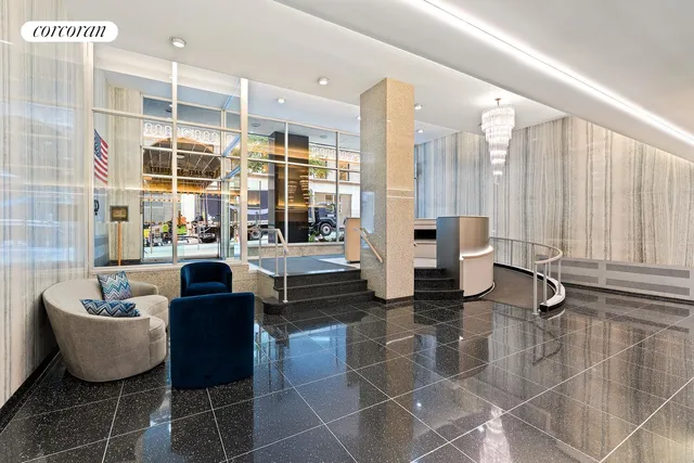 a living room with fireplace furniture and a large window