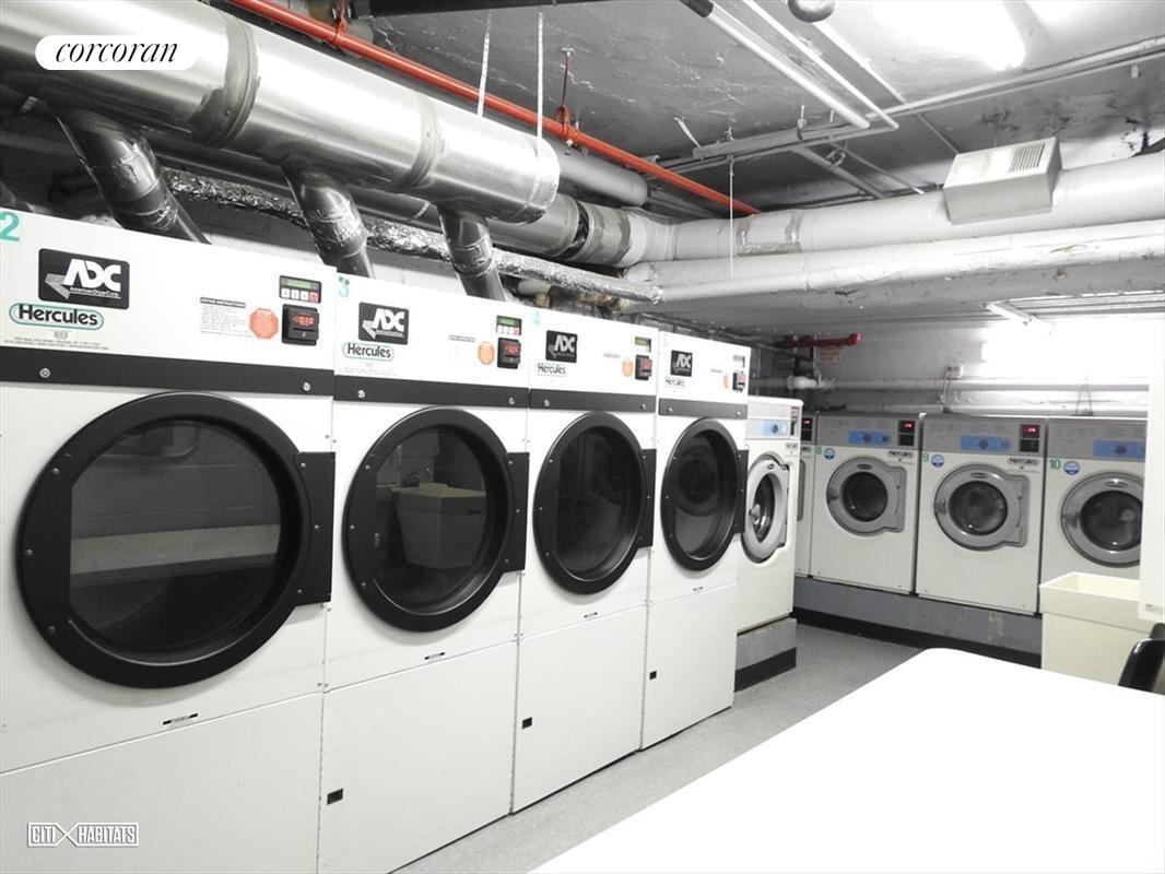 139 East 33rd Street, Unit 7L Manhattan, NY 10016 - Photo 7 of 11 a utility room with dryer and washer