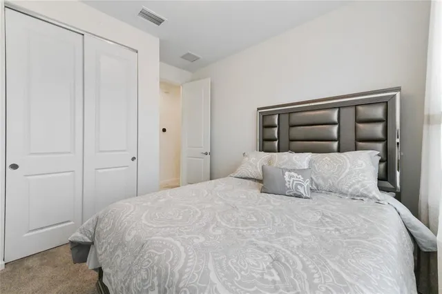 a large white bed in a white room