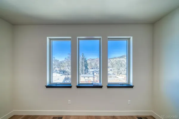 a bathroom with a double vanity sink mirror and toilet