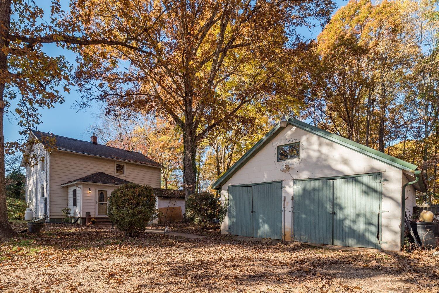 581 Carson Drive Spout Spring, VA 24593 - Photo 14 of 44 a front view of a house with yard and trees