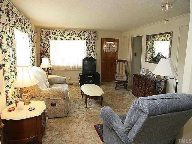 536 Marble Street Raleigh, NC 27603 - Photo 2 of 8 a living room with furniture and a large window