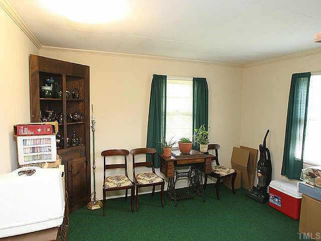 536 Marble Street Raleigh, NC 27603 - Photo 3 of 8 a living room with furniture and a window