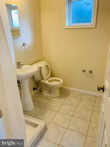 a bathroom with a toilet and a sink