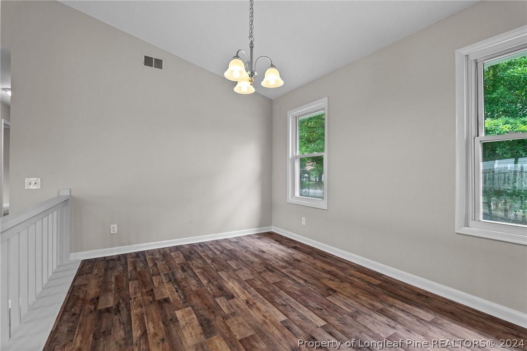 112 Maranatha Circle Spring Lake, NC 28390 - Photo 17 of 33 a view of wooden floor and windows in a room