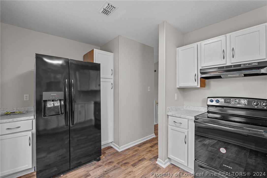 112 Maranatha Circle Spring Lake, NC 28390 - Photo 20 of 33 a kitchen with cabinets and appliances