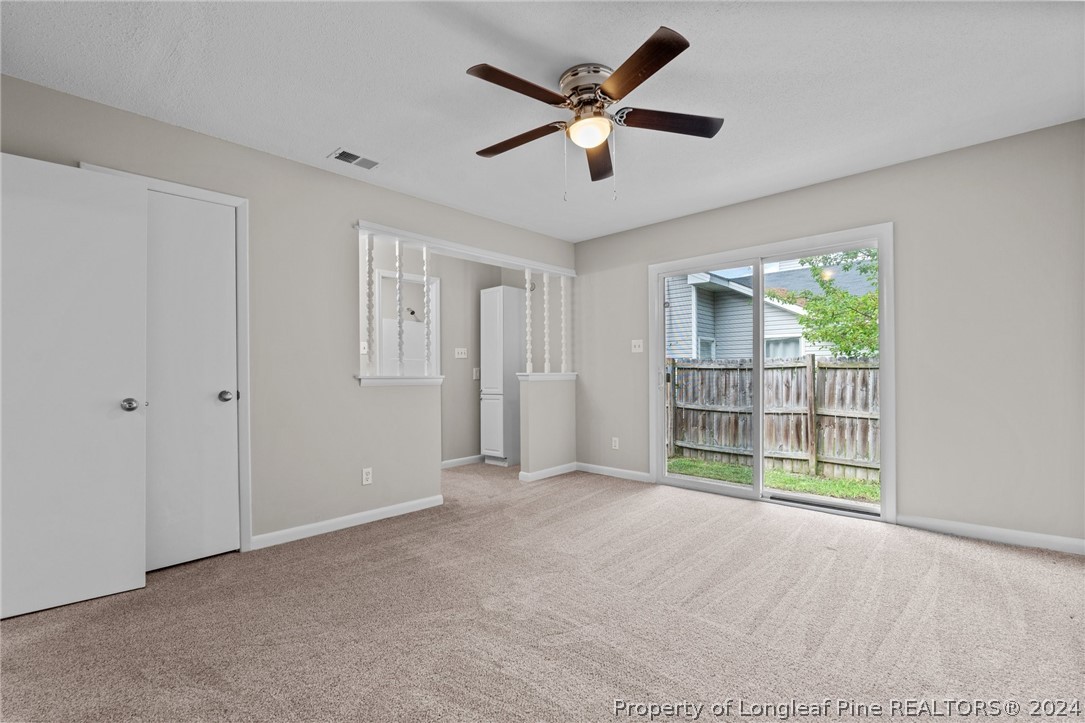 112 Maranatha Circle Spring Lake, NC 28390 - Photo 25 of 33 a view of empty room with wooden floor and ceiling fan