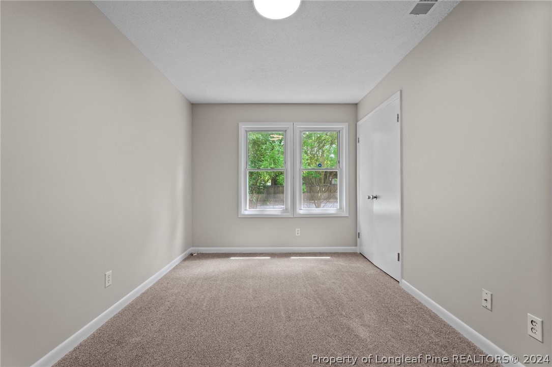 112 Maranatha Circle Spring Lake, NC 28390 - Photo 31 of 33 an empty room with windows