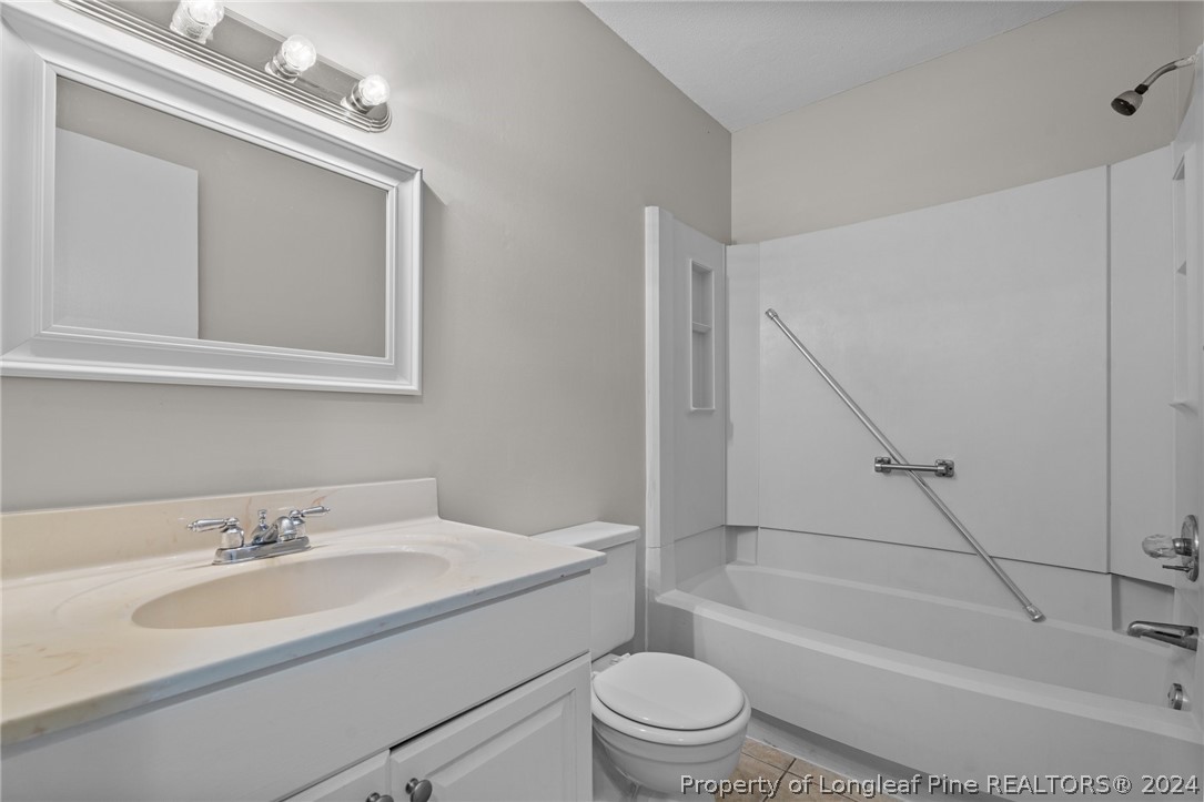 112 Maranatha Circle Spring Lake, NC 28390 - Photo 32 of 33 a bathroom with a toilet a sink and a bathtub