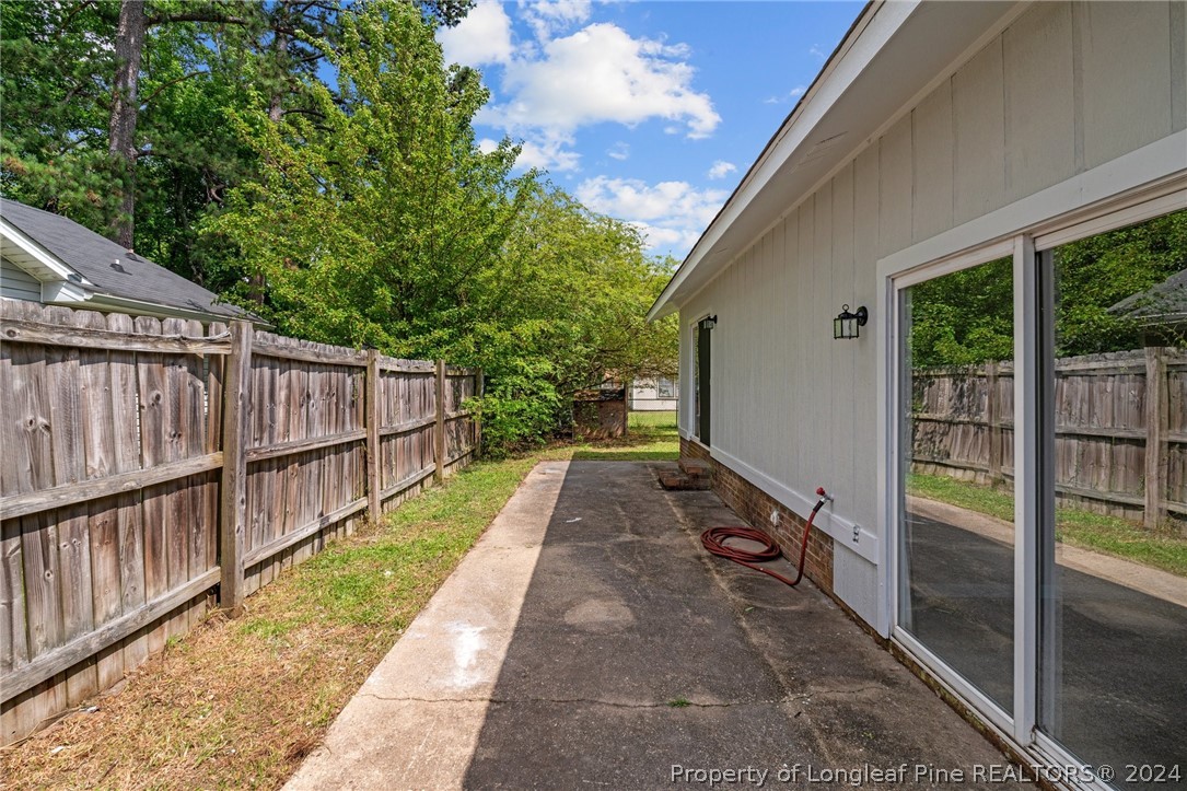 112 Maranatha Circle Spring Lake, NC 28390 - Photo 7 of 33 a view of balcony with wooden floor and fence