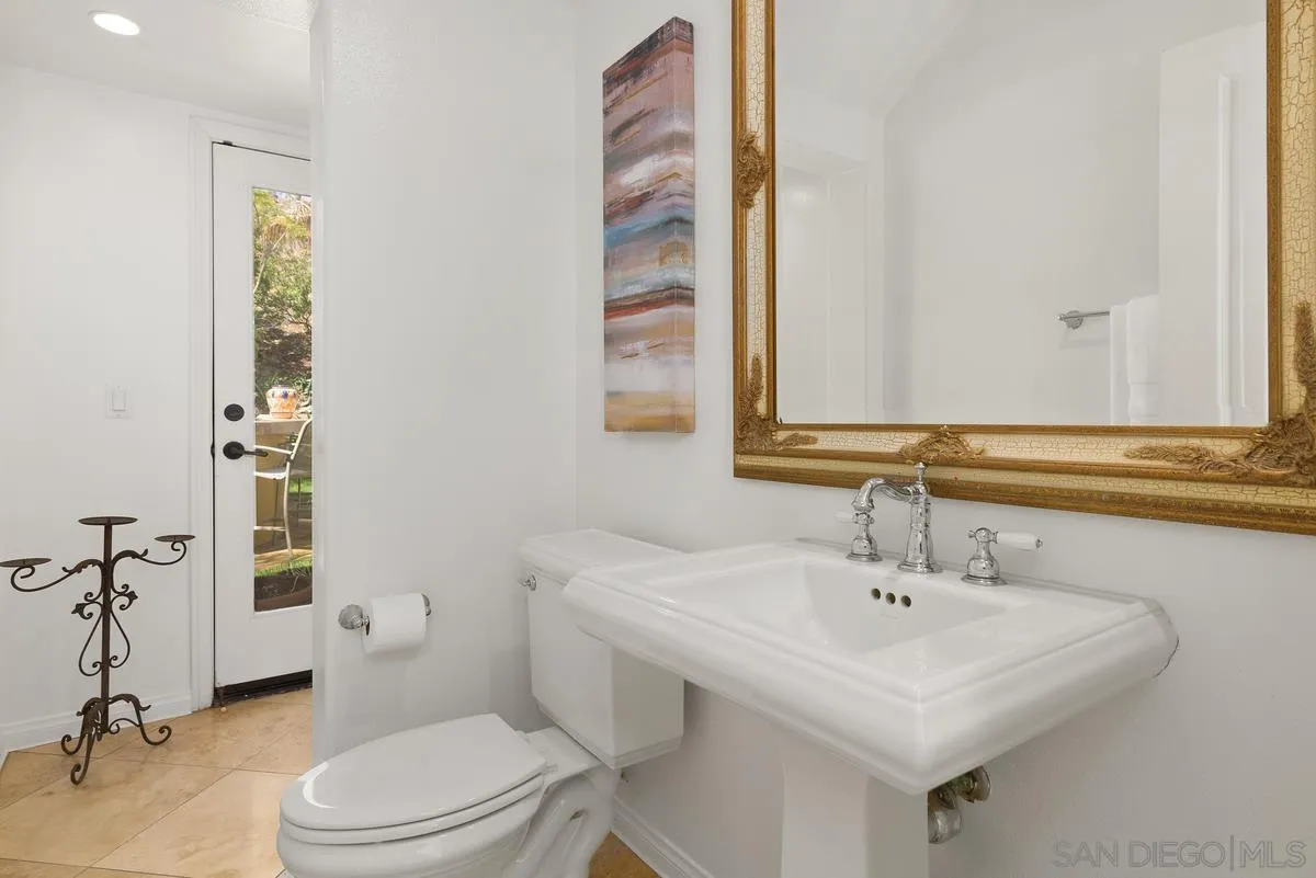 7542 Circulo Sequoia Carlsbad, CA 92009 - Photo 11 of 24 a bathroom with a sink a toilet and shower