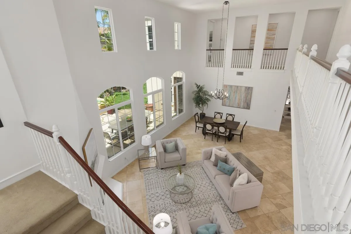 7542 Circulo Sequoia Carlsbad, CA 92009 - Photo 12 of 24 a room with two chandeliers and furniture