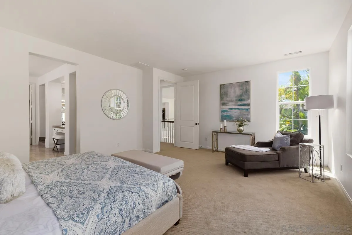 7542 Circulo Sequoia Carlsbad, CA 92009 - Photo 14 of 24 a bedroom with a bed and a couch