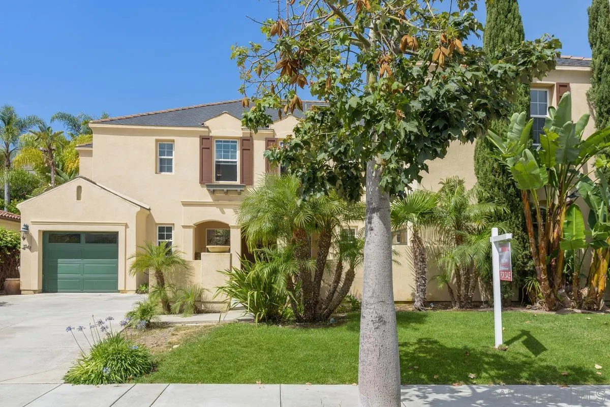 7542 Circulo Sequoia Carlsbad, CA 92009 - Photo 23 of 24 a front view of a house with garden